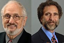 Two headshots of individuals in formal attire, both with facial hair and glasses, against a plain background.